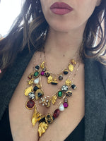 Set di tre collane con charm