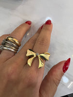 Anello Fiocco con punto luce Swarovski